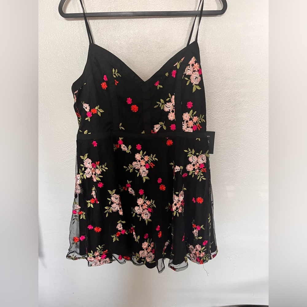 Mini dress from Lulu’s. Hits probably mid thigh. Spaghetti strap. Zip up back.